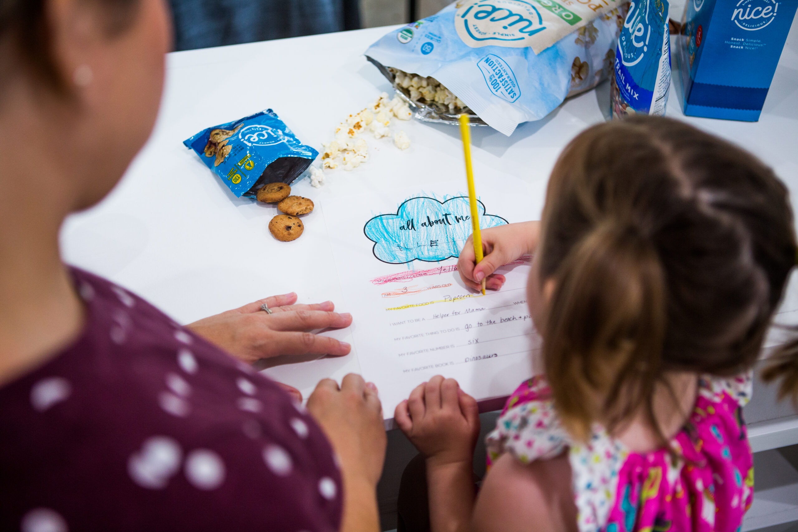 Parent and child drawing together, featured in Nice! brand influencer content
